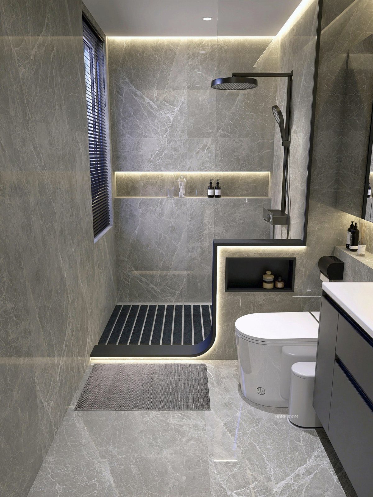 Grey marble tiles covering the walls and floor of a modern small bathroom.